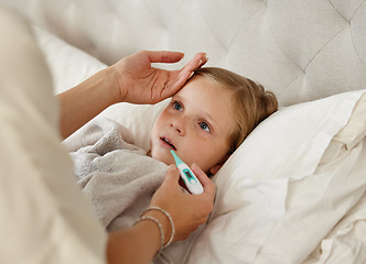 Image showing For he who has health has hope. a woman taking her little girls temperature with a thermometer in bed at home.
