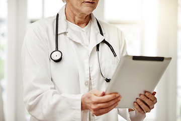 Image showing Put your trust in me. a unrecognizable doctor using a digital tablet in her consulting room.