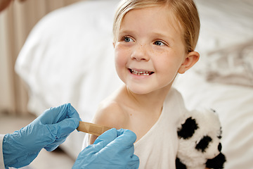 Image showing Healthy and strong. an unrecognizable doctor applying a cotton ball to a patients arm at home.