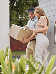 Image showing All I need is a digital signature. an attractive young woman using a tablet to sign for her delivery.