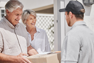 Image showing That was quick. a handsome young male courier delivering a package to a senior couple at their home.