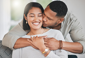 Image showing I never want to stop making memories with you. a young man giving his wife a kiss on the cheek at home.