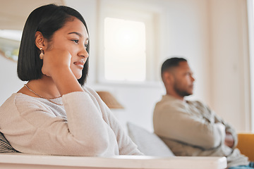 Image showing I deserve better than this. a young couple ignoring each other during an argument at home.