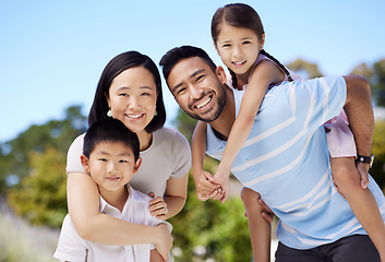 Image showing Family matters most. a young family spending time together in their garden at home.