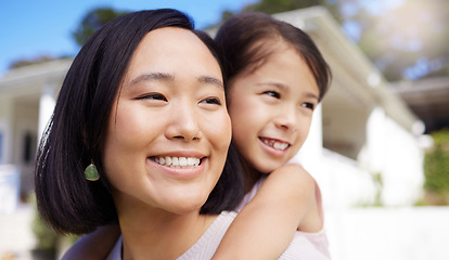 Image showing Smiling our way through life. a young mother and daughter spending time together in the garden at home.