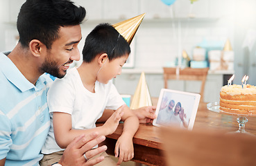 Image showing Use today to feel your best. a father and son using a digital tablet together at home.