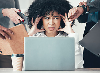 Image showing Can they just go away. an attractive young businesswoman sitting in the office and feeling stressed while her colleagues put pressure on her.