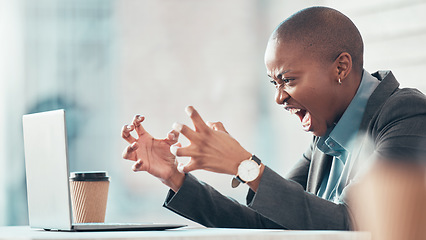 Image showing Stop deleting my work. an attractive young businesswoman sitting alone in the office and feeling angry while using her laptop.