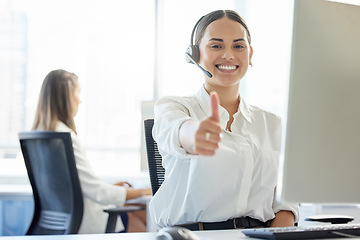 Image showing Delivering exceptional service. a young woman showing thumbs up while working in a call center.