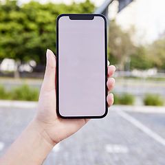 Image showing As long as you have a Phone you’re never alone. an unrecognizable businesswoman using a smartphone outside.