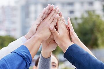 Image showing Cooperation is the thorough conviction. a group of unrecognizable businesspeople high fiving while standing outside.