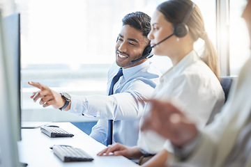 Image showing Being helpful is always a good quality to have. two colleagues discussing something while working in a call center.