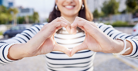 Image showing Your heart dont stand a chance. an unrecognisable businesswoman making a heart shaped gesture with her hands outside.