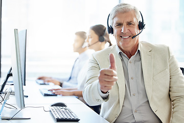 Image showing Making sure the customer is always happy. a mature man showing thumbs up while working in a call center.