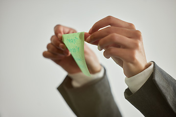 Image showing To get to the goal, stick to the plan. an unrecognisable businessman sticking a note to a glass screen in a modern office.