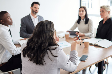 Image showing She leads the meeting. a group of businesspeople in a meeting at work.