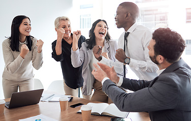 Image showing Surround yourself with people who cheer you on. a group of businesspeople cheering in a meeting at work.