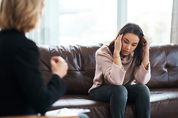 Image showing Theres a war going on between me and my mind. a young woman having a therapeutic session with a psychologist.