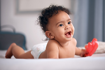 Image showing Eat, sleep, play…repeat. an adorable baby boy playing on the bed at home.