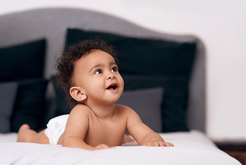 Image showing Youre never too little to dream big. an adorable baby boy on the bed at home.