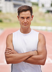 Image showing Ready to do this. Portrait of a determined looking athlete standing on the track.