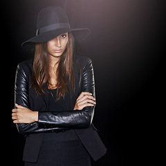 Image showing Mysterious confidence. Cropped portrait of a beautiful woman wearing black.