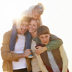 Image showing Keep your loved ones close. Cropped portrait of a loving family standing together in the outdoors.