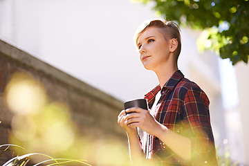 Image showing Coffee breaks in my garden. A cropped shot of a beautful young woman drinking coffee in her garden.