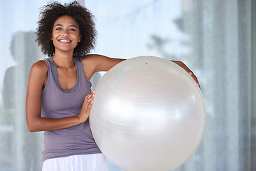 Image showing Nothing beats the exercise ball. Cropped portrait of an attractive young woman standing with an exercise ball.