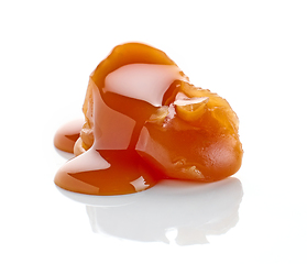 Image showing caramel candy with melted caramel sauce