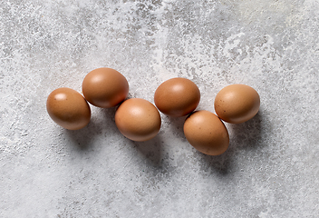 Image showing brown eggs on light grey background