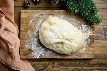 Image showing dough on wooden cutting board