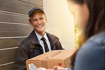 Image showing Ive got your package. a young man making a delivery to a woman at her home.