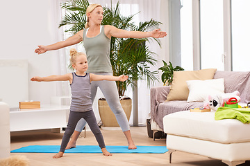 Image showing Yoga has no age restriction. Full length shot of a mother and daughter doing yoga together.