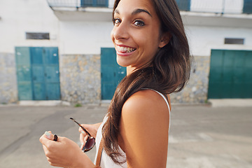 Image showing Im one happy girl in Italy. an attractive young woman standing alone and enjoying her holiday in Italy.