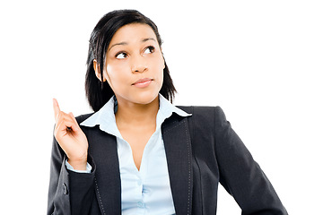 Image showing Its never too late to change course. a young businesswoman looking up as she gets an idea against a studio background.