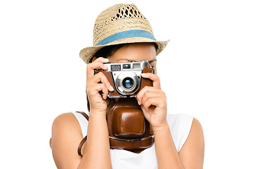 Image showing You wont believe your eyes. a young woman taking photos using her digital camera against a studio background.