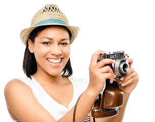 Image showing She will capture a lifetime of memories. Beautiful mixed race woman taking photograph vintage camera isolated on white background.