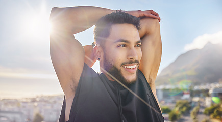 Image showing Spend some time to put time back into your life. a sporty young man stretching while on a rooftop.