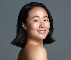 Image showing Im hooked on this new skincare product. Studio shot of a beautiful young woman posing against a grey background.