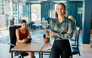 Image showing Im going places. Cropped portrait of an attractive young businesswoman standing with her arms folded in the office.