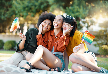 Image showing Admires the flowers in your garden. a group of friends sitting in a park.