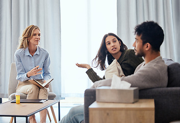 Image showing Patience is the path to peace. a couple having an argument during a counseling session with a therapist.