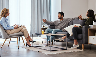 Image showing Dont hold yourself back with self doubt. a couple having an argument during a counseling session with a therapist.