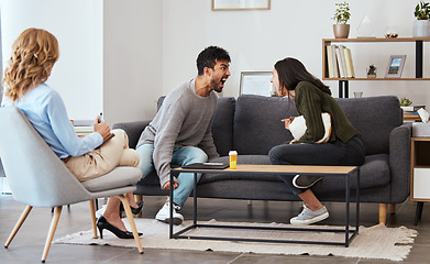 Image showing Your mental disorder doesnt have to define you. Seek help. a couple having an argument during a counseling session with a therapist.