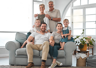 Image showing Happiness is having a large family. a happy family relaxing on the sofa at home.