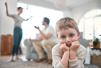 Image showing Adults are just outdated children. a little boy looking sad while his parent argue at home.