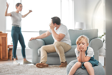 Image showing Children need models rather than critics. a little girl looking sad while her parent argue at home.