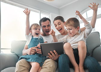 Image showing We appreciate every visit. a young family using a digital tablet at home.