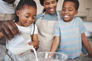 Image showing Baking cookies is comforting. a family baking together in the kitchen.